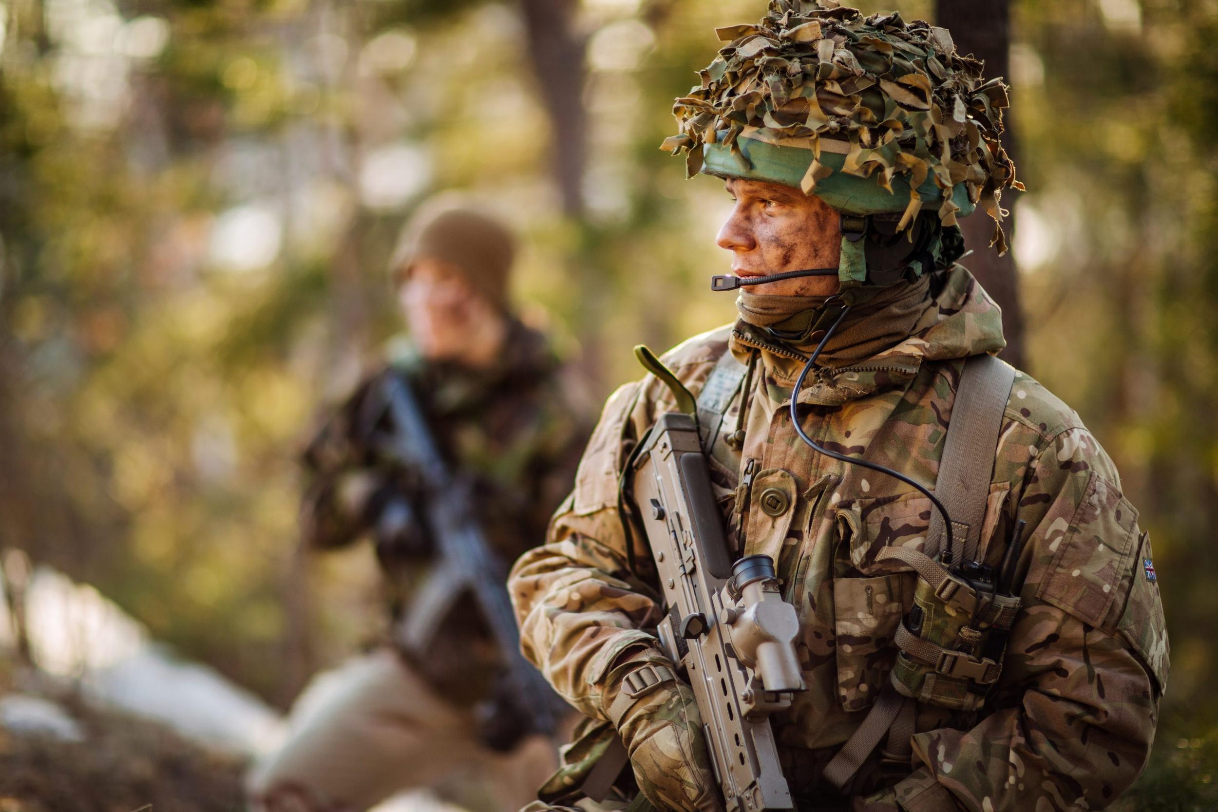 British special forces soldier with weapon take part in military maneuver. war, army, technology and people concept.